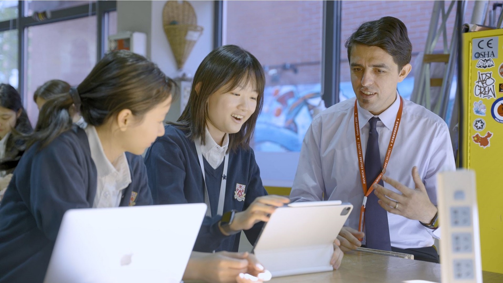 Mr Yosef Karasik and students in class