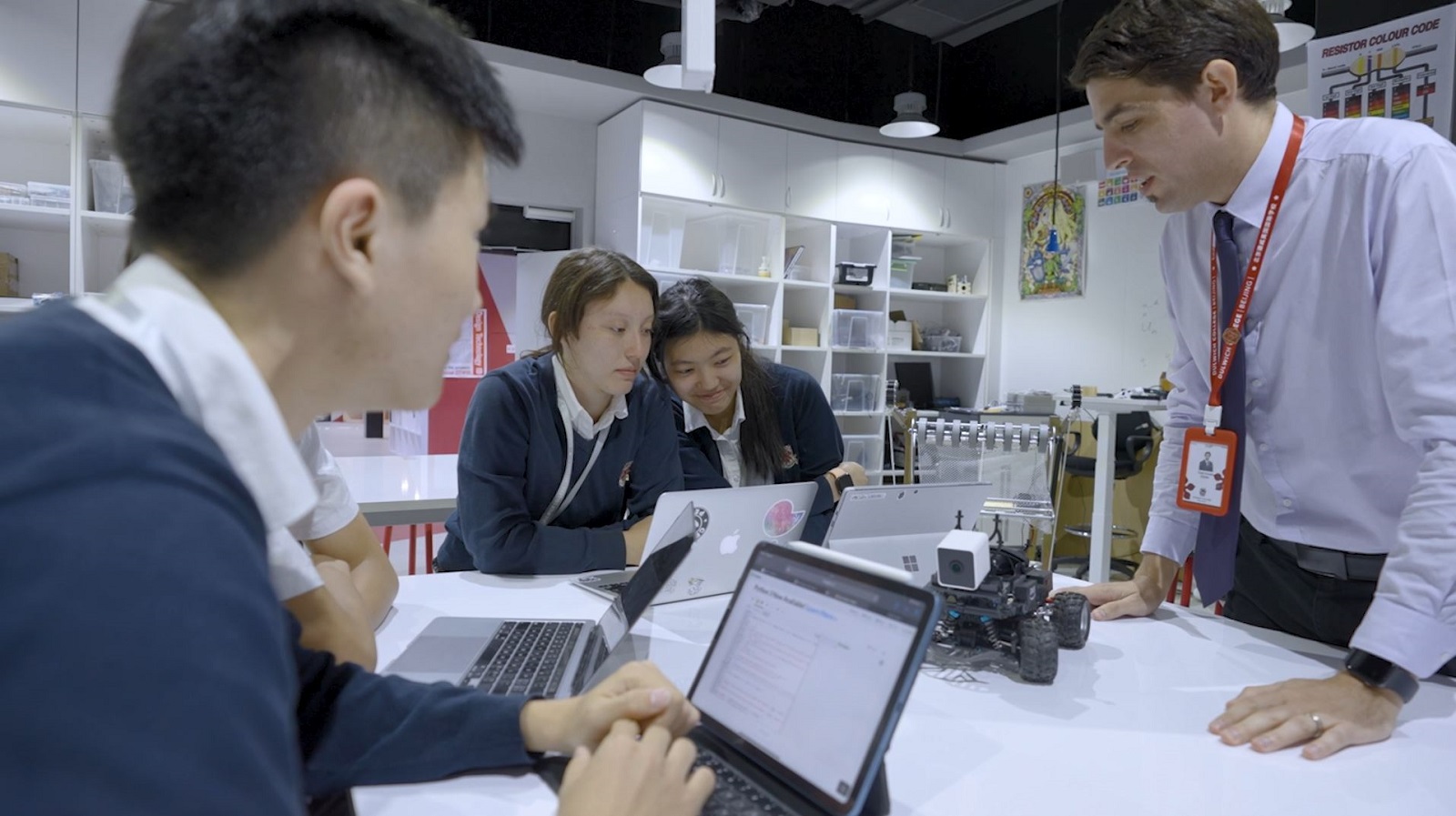 Mr Yosef Karasik and students in class