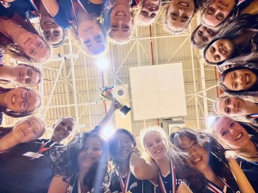Shu Yong celebrates a netball championship