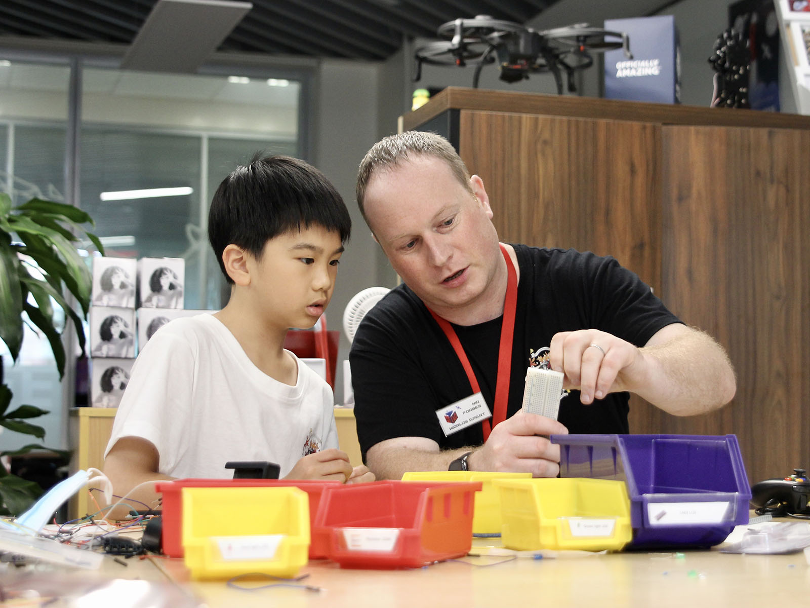 Head of Computer Science Paul Forbes works with student in a HakD workshop