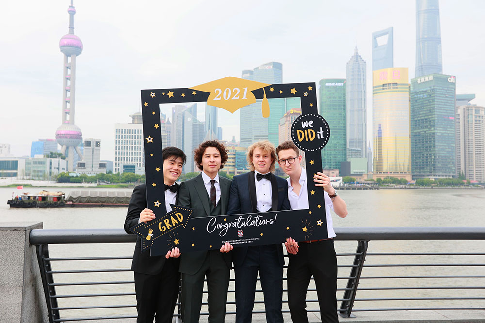 Derek with classmates during the Graduation Dinner on the Bund
