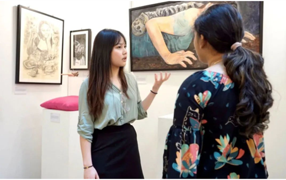 Vanessa introduces her art at the IB art exhibition