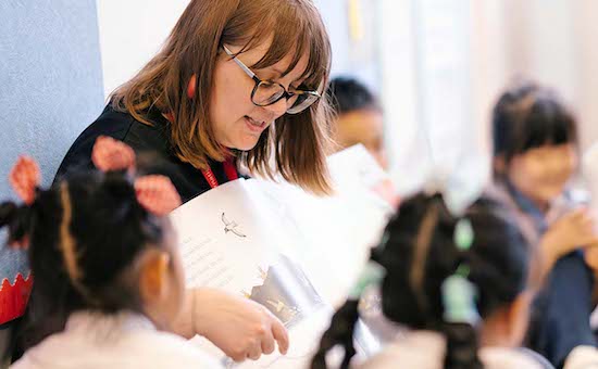 Teacher Reading to Children