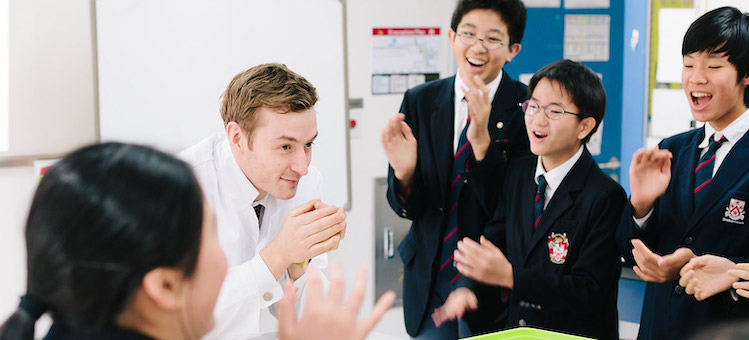 Teacher Engaging with School Children