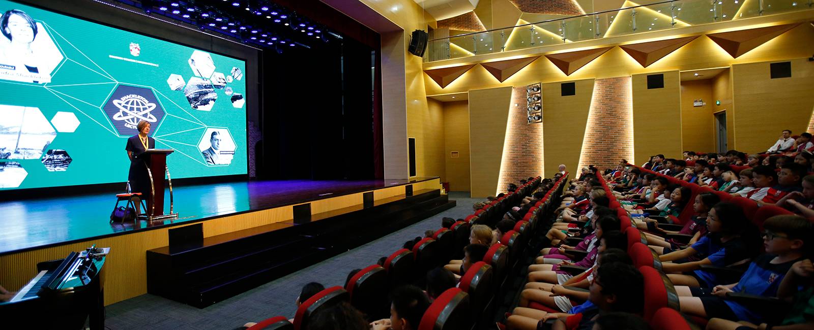 The Honourable Alexandra Shackleton speaks to Year 5 and 6 students assembled in Mei Lan Fang Theatre.